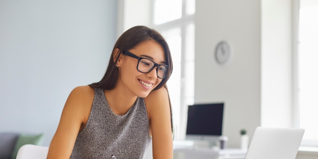 happy woman at desk