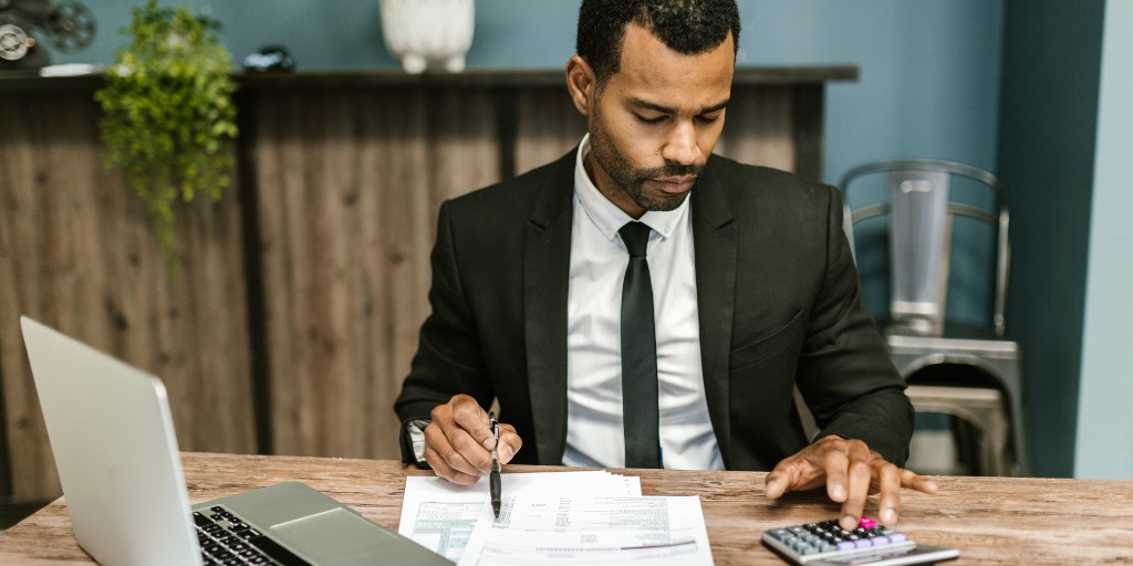 man reviewing financial reports