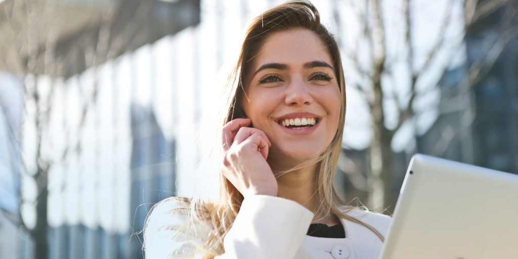 Woman smiling while talking on phone